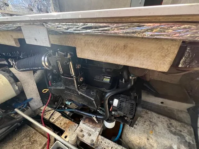 Slide: The Image of Engine compartment of a 1985 Trojan 11 Meter Express boat, showcasing mechanical components. - 13