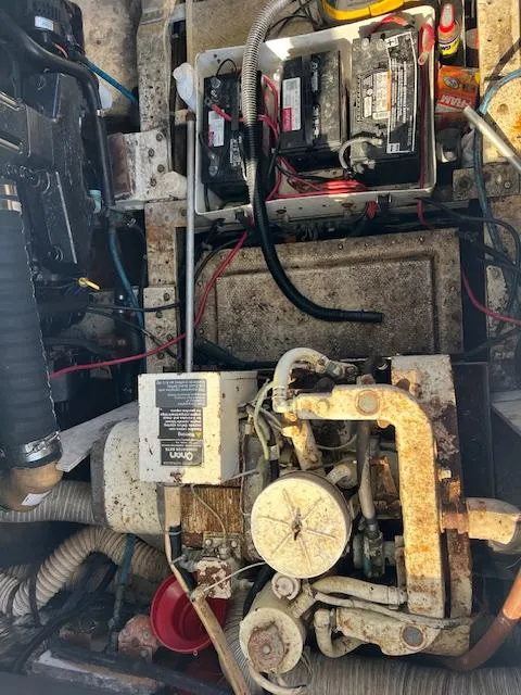 Slide: The Image of 1985 Trojan 11 Meter Express engine compartment with visible batteries and mechanical components. - 4