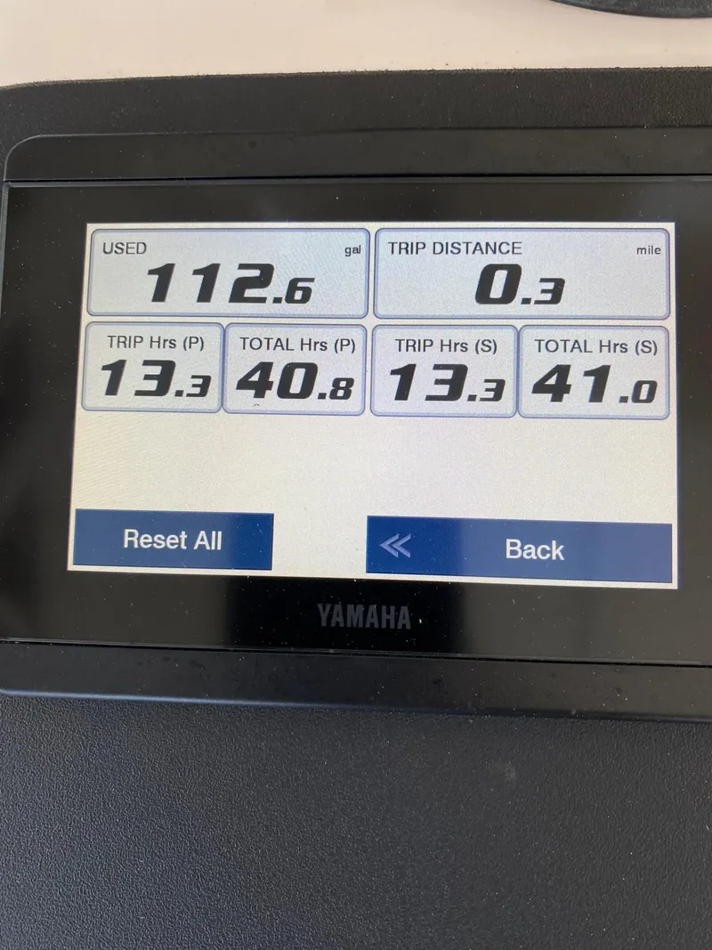 Slide: The Image of Yamaha display showing fuel usage and trip data for 2002 Intrepid 323 Cuddy. - 19
