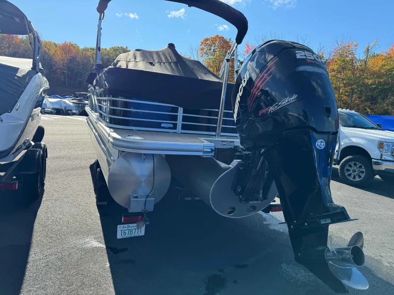 Slide: The Image of 2018 Bennington R25 pontoon boat with Mercury 250 outboard motor in parking lot. - 3