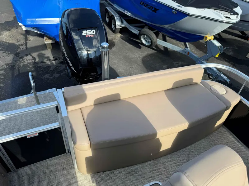 Slide: The Image of 2018 Bennington R25 boat with beige seating and a 250 Pro motor. - 6