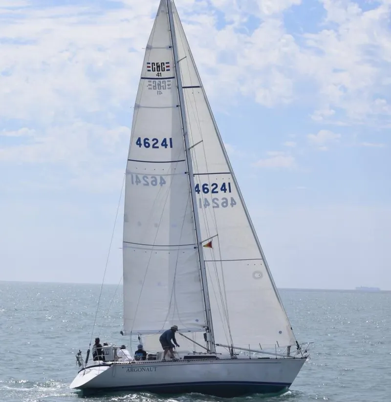 Slide: The Image of 1985 C&C 41 sailboat cruising on open sea. - 1
