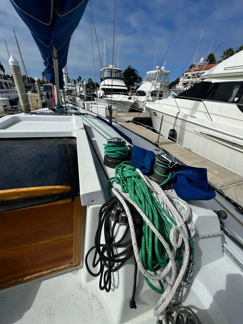 Slide: The Image of 1985 C&C 41 sailboat docked with ropes and equipment. - 10