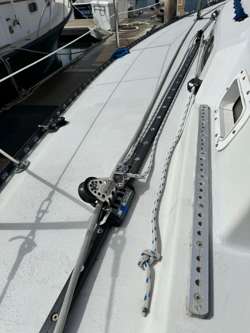 Slide: The Image of Deck of a 1985 C&C 41 sailboat with tracks and ropes. - 11