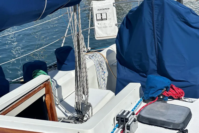 Slide: The Image of Cockpit of a 1985 C&C 41 sailboat with blue covers. - 14