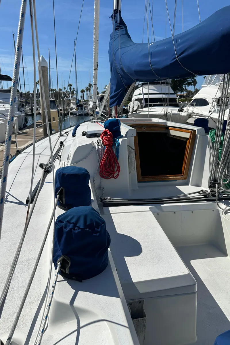 Slide: The Image of 1985 C&C 41 sailboat docked at marina. - 15