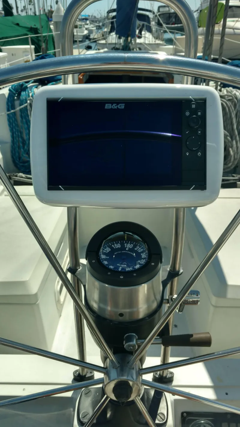 Slide: The Image of Steering wheel and navigation system on a 1985 C&C 41 yacht. - 16