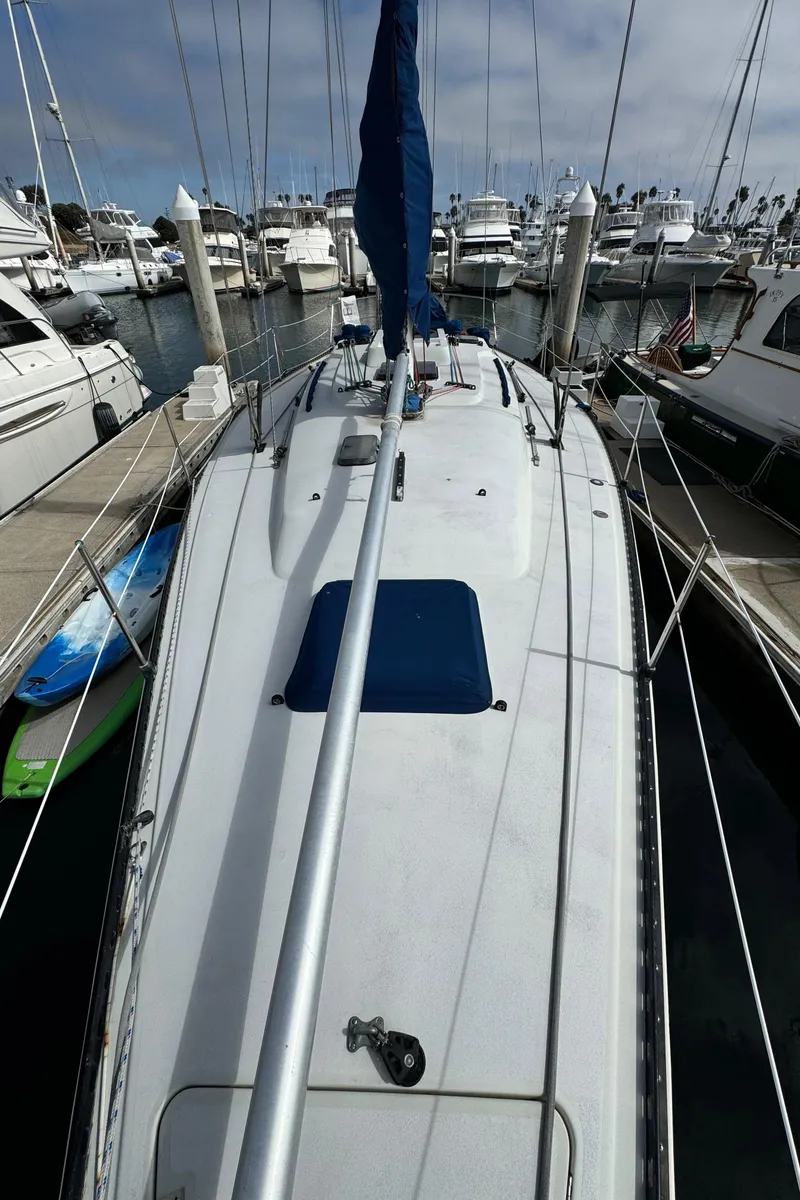 Slide: The Image of 1985 C&C 41 sailboat docked in marina. - 19