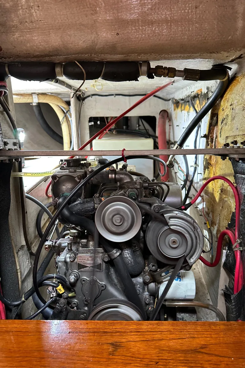 Slide: The Image of Engine compartment of a 1985 C&C 41 sailboat with visible wiring. - 22