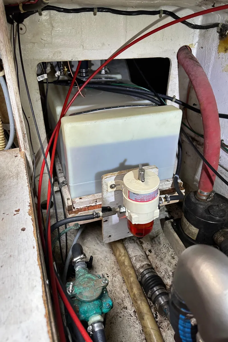 Slide: The Image of Engine compartment of a 1985 C&C 41 sailboat with fuel filter. - 23