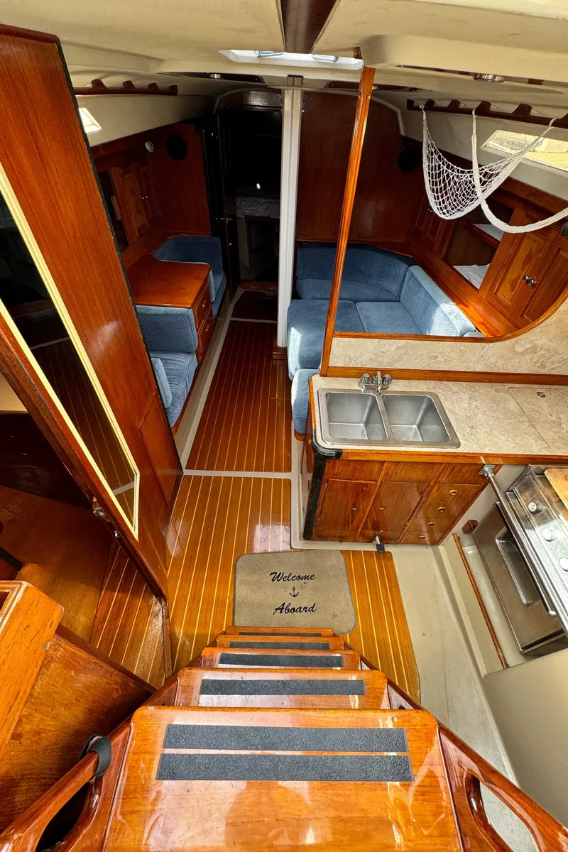 Slide: The Image of Interior of a 1985 C&C 41 yacht with wooden floors and kitchen. - 31