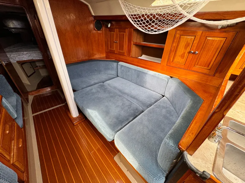 Slide: The Image of Interior of a 1985 C&C 41 yacht with blue upholstery. - 33