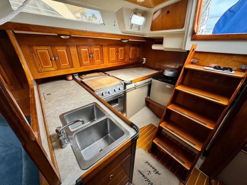 Slide: The Image of Interior of a 1985 C&C 41 yacht with wooden cabinetry. - 35