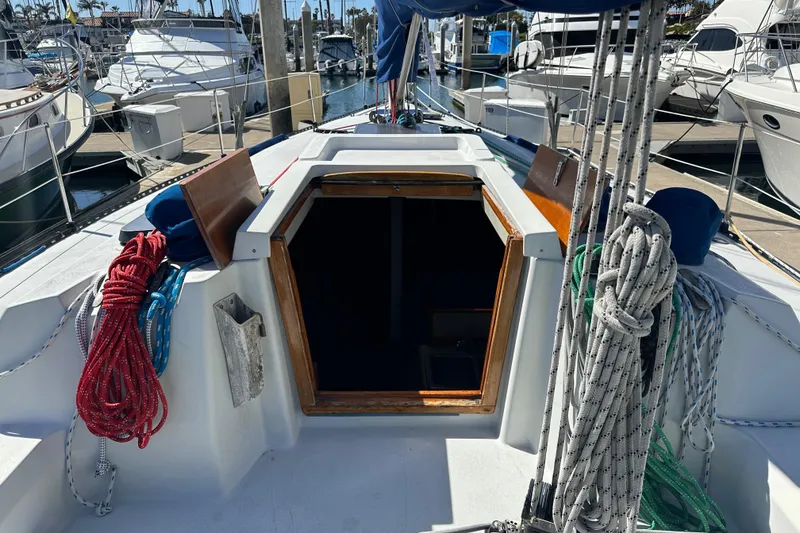 Slide: The Image of 1985 C&C 41 sailboat in harbor, open cabin door. - 8
