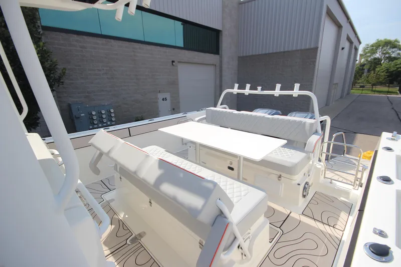 Slide: The Image of 2026 Zodiac X10CC boat interior with seating and table, featuring modern design and joystick controls. - 10