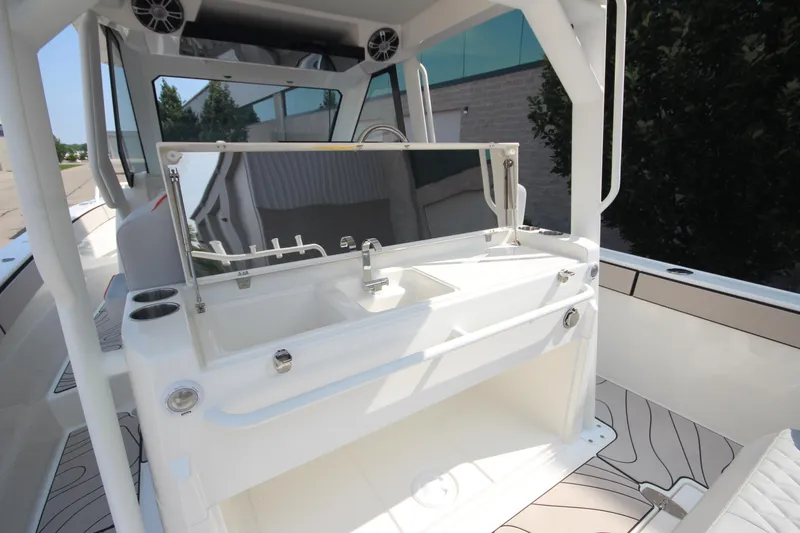 Slide: The Image of 2026 Zodiac X10CC boat interior with sink and joystick controls. - 13