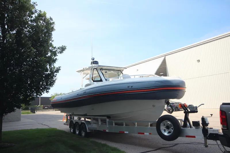 Slide: The Image of 2026 Zodiac X10CC boat on trailer, featuring twin Yamaha F350XSA engines with joystick control. - 2