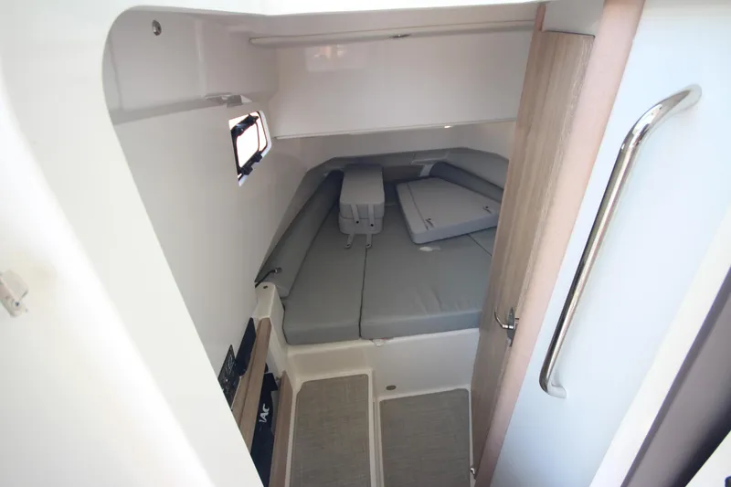Slide: The Image of 2026 Zodiac X10CC cabin interior with gray cushions and compact design. - 22