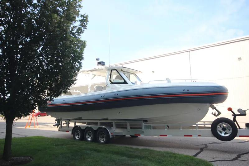Slide: The Image of 2026 Zodiac X10CC boat on trailer, featuring Twin Yamaha F350XSA engines with joystick control. - 3