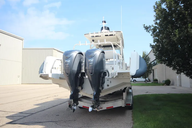 Slide: The Image of 2026 Zodiac X10CC boat with twin Yamaha F350XSA engines and joystick, parked on trailer. - 5
