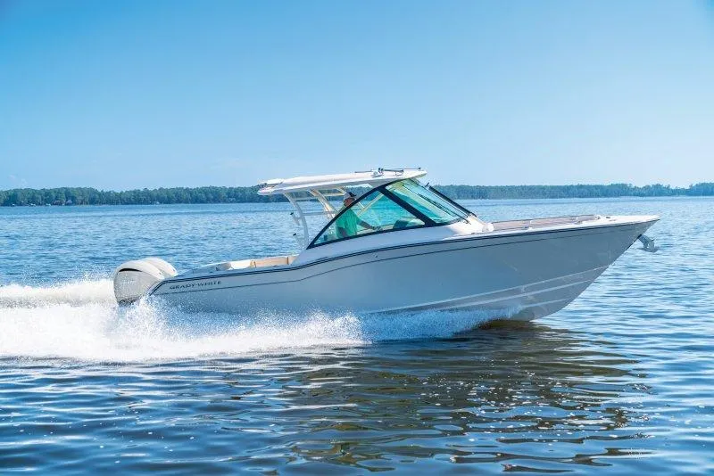 Slide: The Image of 2025 Grady-White Freedom 325 boat cruising on a sunny day. - 1