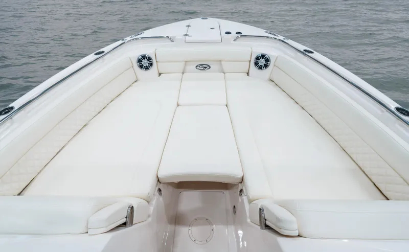 Slide: The Image of 2025 Grady-White Freedom 325 boat interior with white seating and speakers. - 10