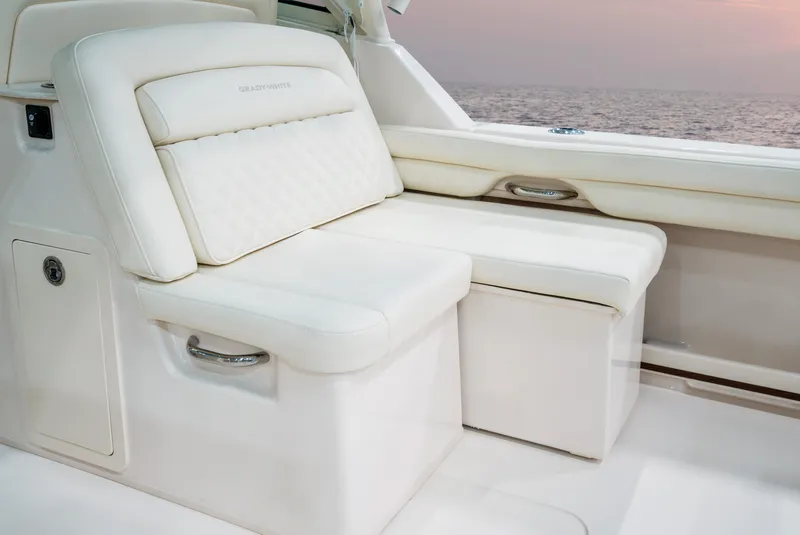 Slide: The Image of 2025 Grady-White Freedom 325 boat interior with luxurious white seating. - 9