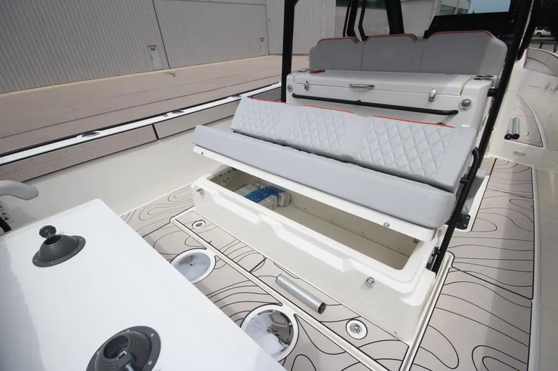 Slide: The Image of 2025 Zodiac X10CC boat interior with seating and table, featuring modern design and joystick controls. - 12