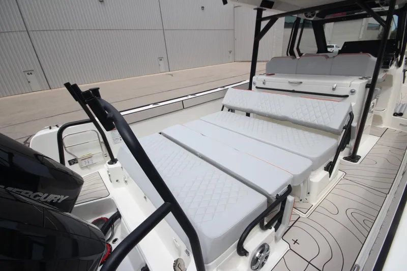 Slide: The Image of 2025 Zodiac X10CC boat interior with storage compartment and seating. - 15