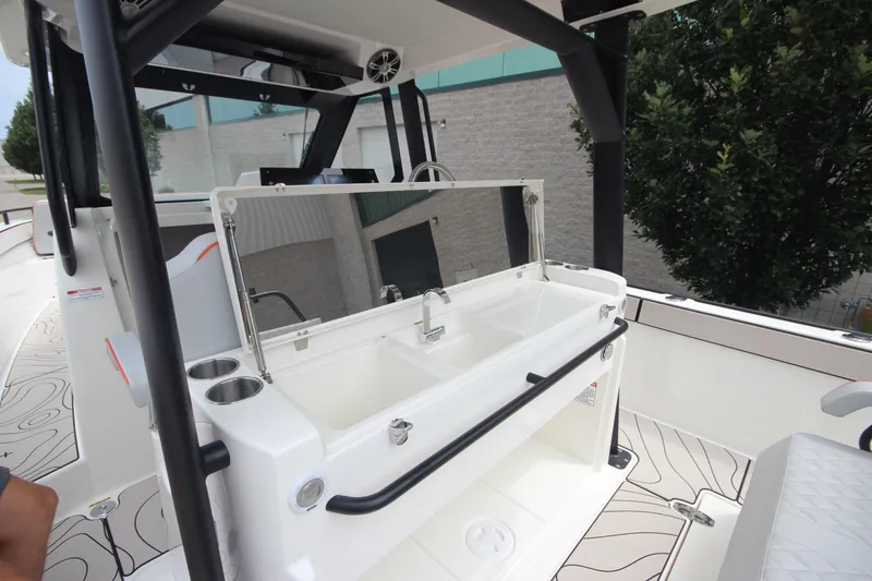 Slide: The Image of 2025 Zodiac X10CC boat with twin Mercury 400 engines and joystick control, docked outdoors. - 17