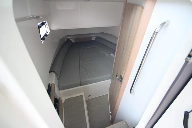 Slide: The Image of 2025 Zodiac X10CC boat interior with joystick, featuring modern seating and control panel. - 22