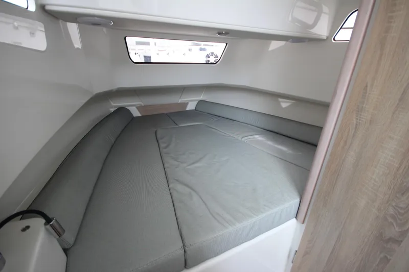 Slide: The Image of 2025 Zodiac X10CC boat cockpit with joystick, twin Mercury 400 engines, modern steering controls. - 23