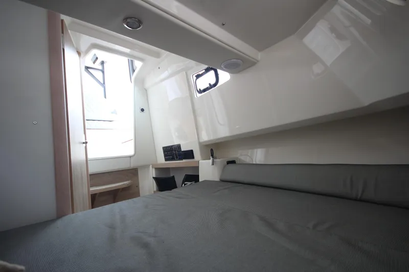 Slide: The Image of Cabin interior of 2025 Zodiac X10CC boat with comfortable seating and modern design. - 25