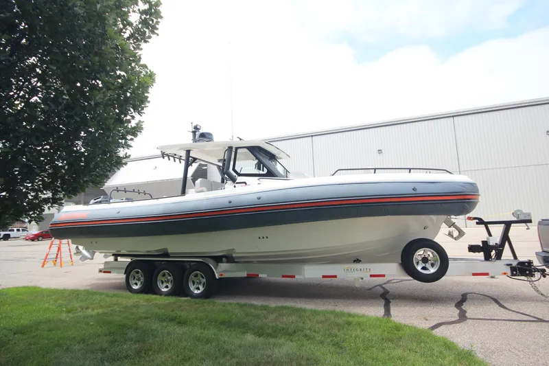 Slide: The Image of 2025 Zodiac X10CC boat on trailer, featuring Twin Mercury 400 engines with joystick control. - 3