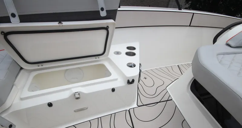 Slide: The Image of 2025 Zodiac X10CC boat interior with seating, table, and cup holders. - 34