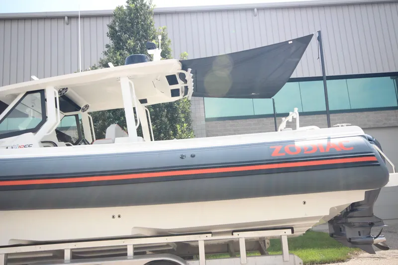 Slide: The Image of 2025 Zodiac X10CC boat interior with storage compartment and seating. - 37