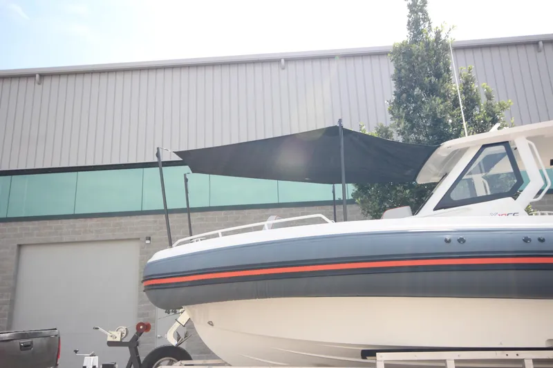 Slide: The Image of 2025 Zodiac X10CC boat interior with cushioned seating and modern design. - 39