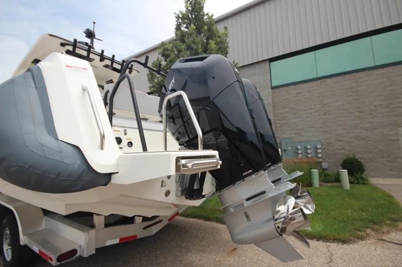 Slide: The Image of 2025 Zodiac X10CC boat with Twin Mercury 400 engines on display indoors. - 4