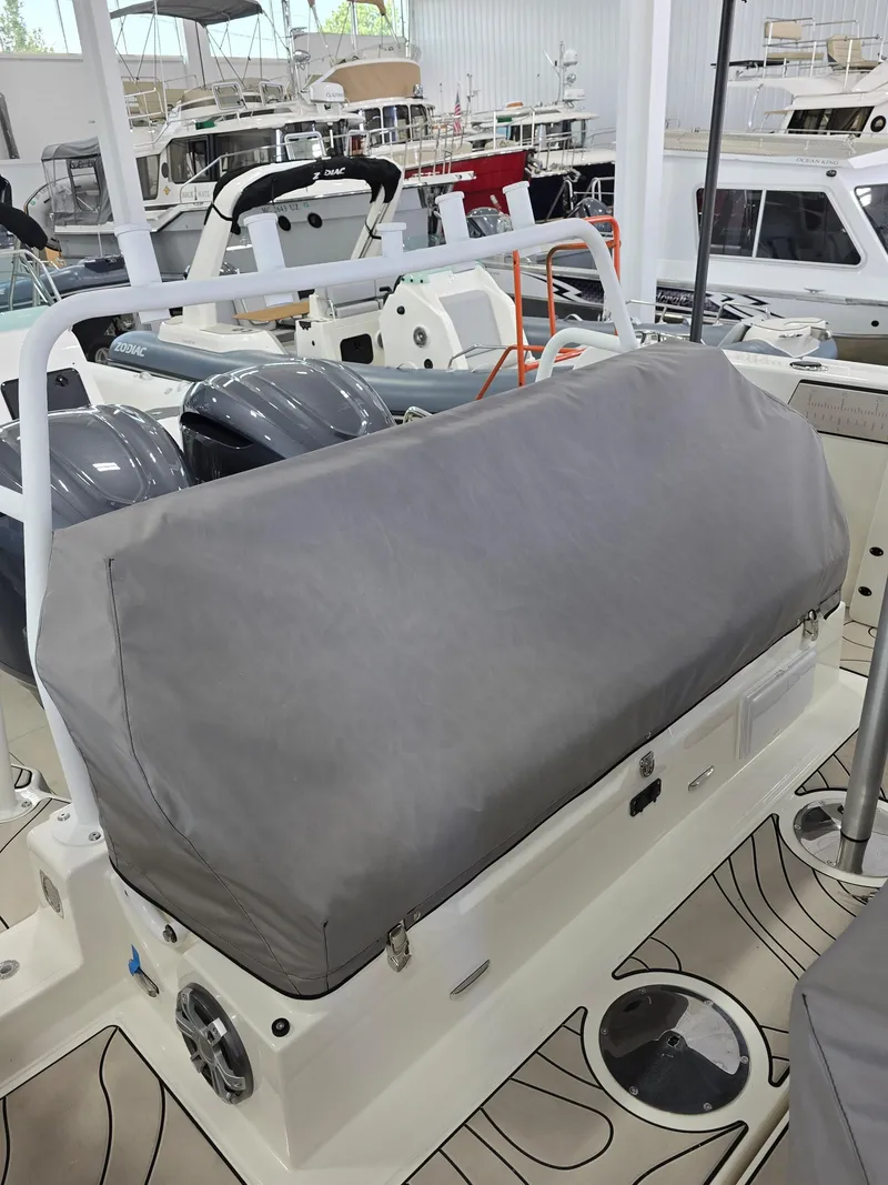 Slide: The Image of 2025 Zodiac X10CC boat with twin Mercury 400 engines, joystick control, covered seating area. - 40