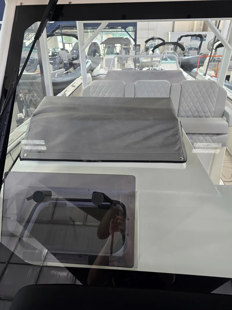 Slide: The Image of 2025 Zodiac X10CC boat interior with joystick controls and seating. - 42
