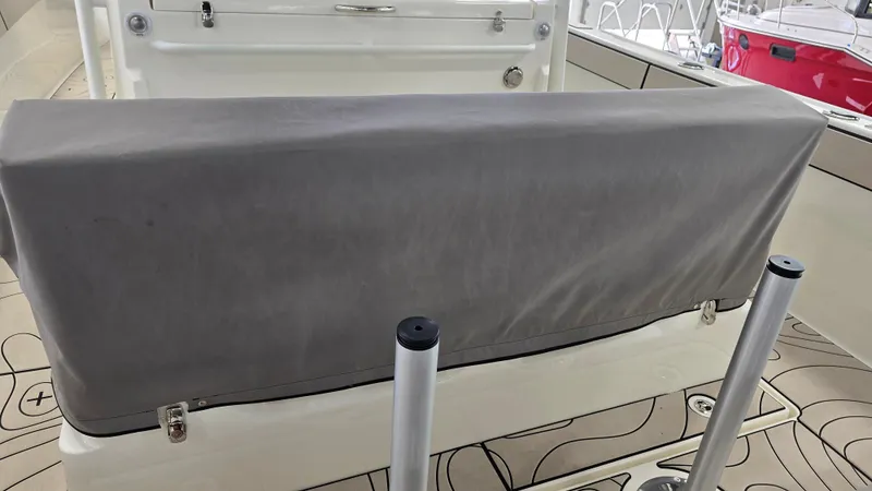 Slide: The Image of Covered seating area on a 2025 Zodiac X10CC boat with joystick controls. - 46