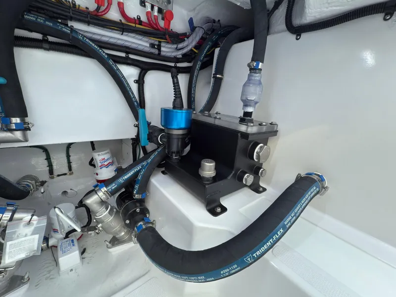 Slide: The Image of Engine compartment of 2025 Mag Bay 38 Center Console with hoses and fittings. - 33
