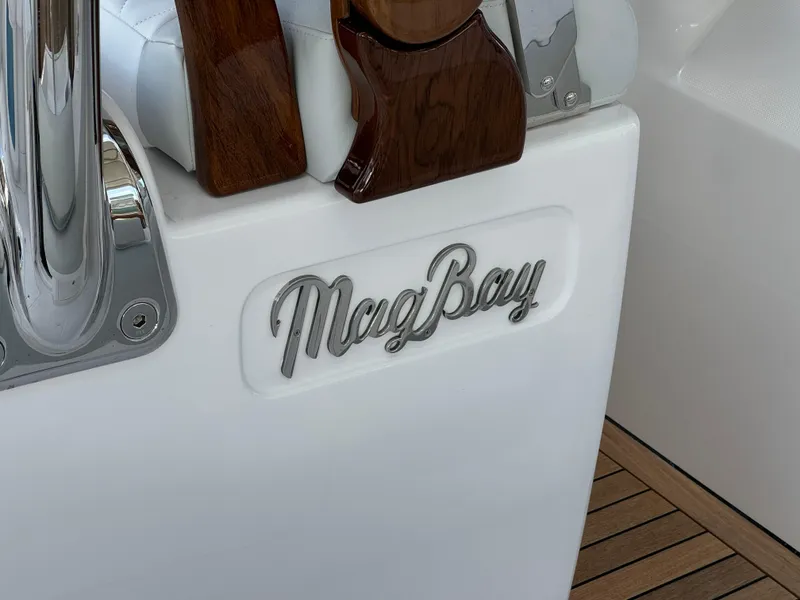 Slide: The Image of 2025 Mag Bay 38 Center Console logo on sleek white surface. - 21