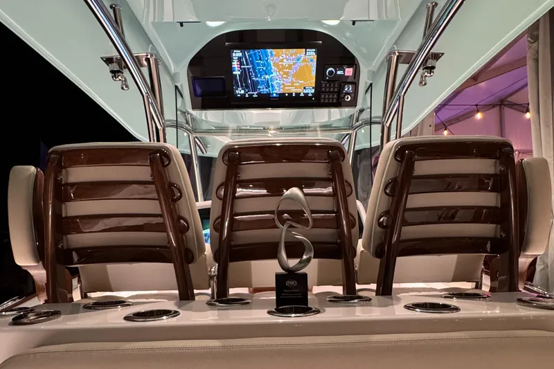 Slide: The Image of 2025 Mag Bay 38 Center Console interior with navigation display and seating. - 30