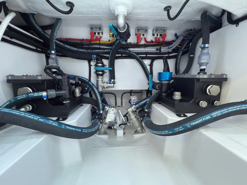 Slide: The Image of 2025 Mag Bay 38 Center Console engine compartment with advanced wiring and hydraulic systems. - 32