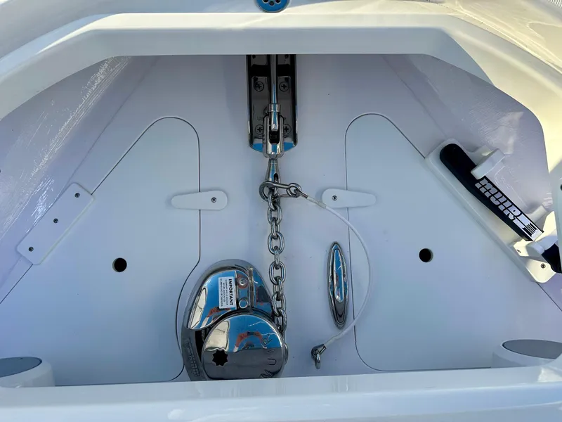 Slide: The Image of 2025 Mag Bay 38 Center Console anchor compartment with chain and winch. - 45