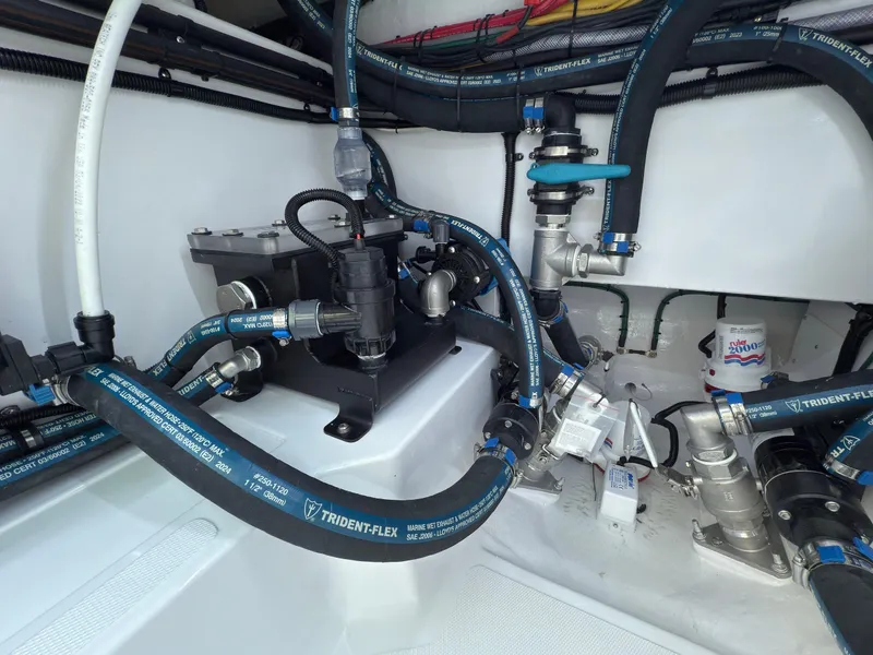 Slide: The Image of Engine compartment of 2025 Mag Bay 38 Center Console with Trident-Flex hoses. - 34
