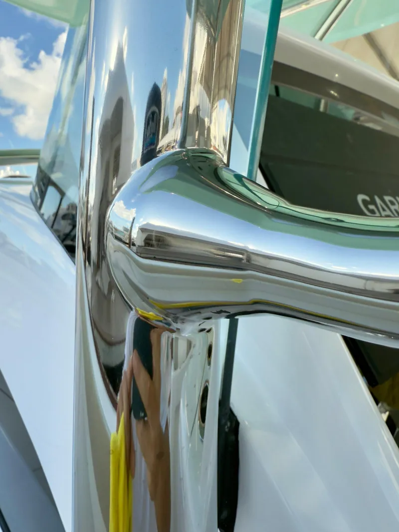 Slide: The Image of Close-up of 2025 Mag Bay 38 Center Console's polished chrome detail. - 42