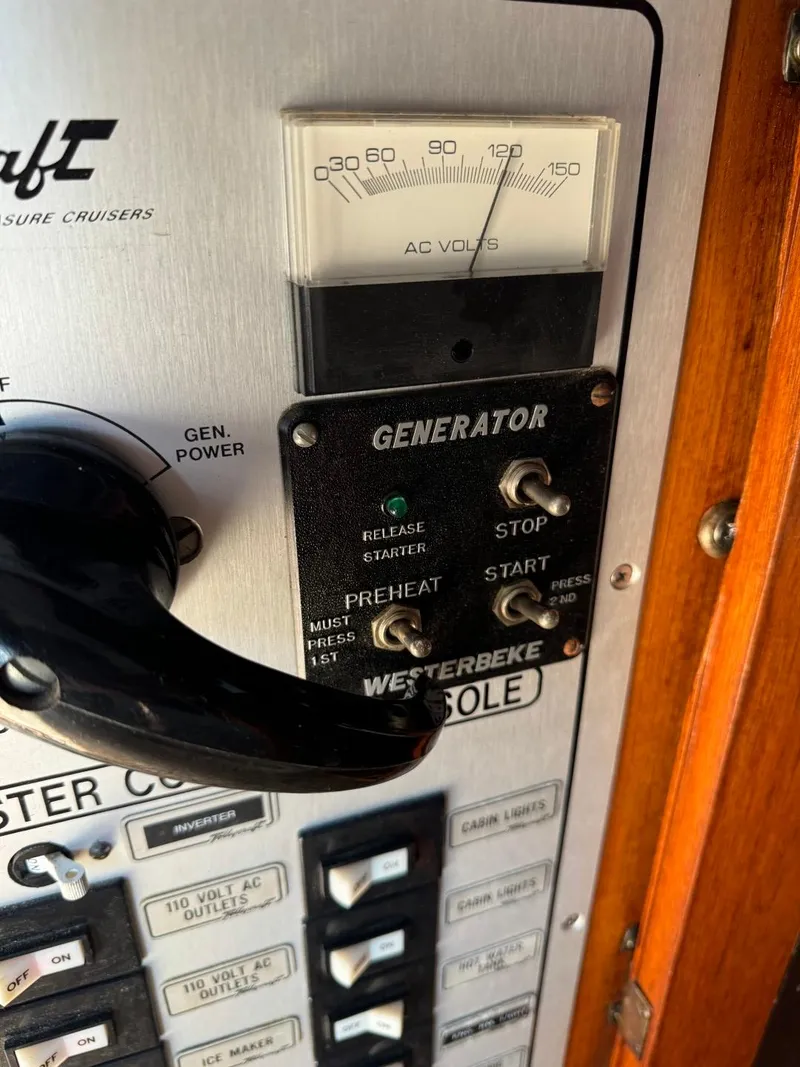 Slide: The Image of Control panel of a 1984 Tollycraft 48 Cockpit Motor Yacht with generator switches. - 21