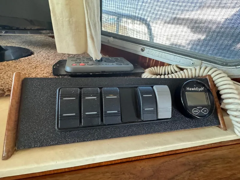 Slide: The Image of Control panel of a 1984 Tollycraft 48 Cockpit Motor Yacht with HawkEye display. - 29